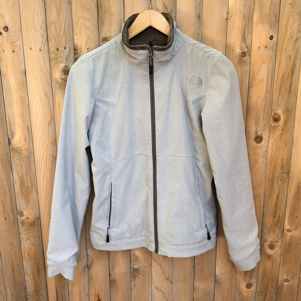 The North Face Grey jacket with Fleece. Small white stain as seen in last photo.